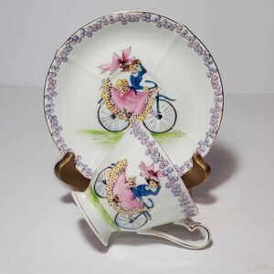 Girl On Bike Teacup and Saucer Hand Painted Vintage